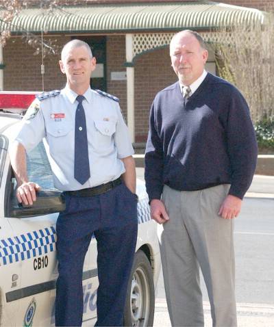 PERSONAL LOSS: Inspector Greg Pringle and police administration manager John Pirie have personal experience of the loss of someone close on Police Remembrance Day. Photo: JUDE KEOGH 0926police2
