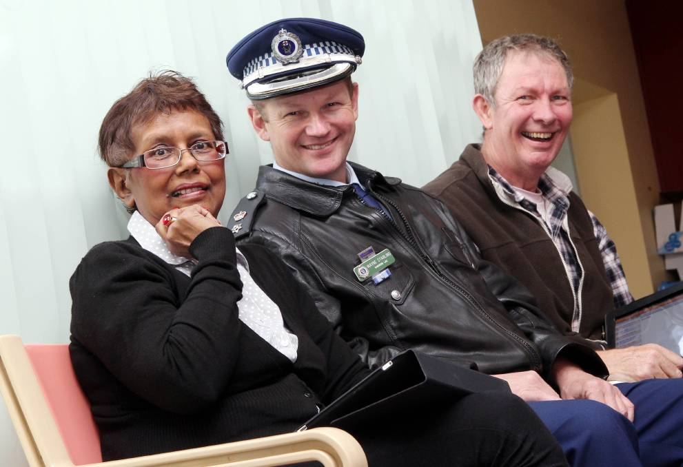 Money raised from the 2011 police charity ball went to Motor Neurone Disease Services at Port Kembla Hospital. Motor Neurone sufferers Cathy Buzak, and Paul Nixon with Superintendent Wayne Starling got to experiment with iPads to communicate. 