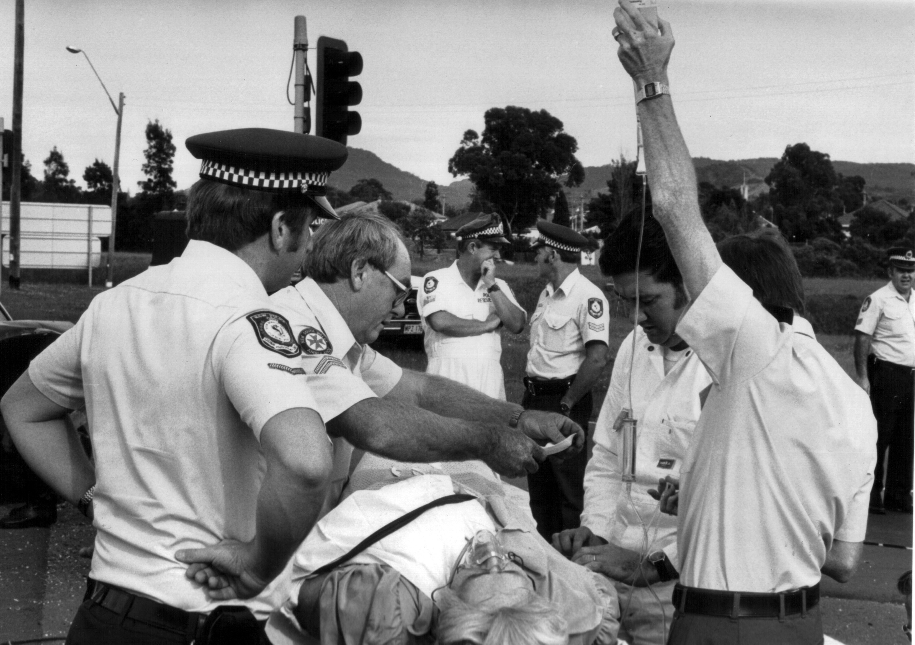 A/O K. PEARCE A/PARAMEDIC J. WOODS CST 1/C GARY THOMPSON, SGT TED DOHERTY (WHITE OVERALLS), S/C RON FOX ?, SGT PETER LINCOLN (FAR RIGHT) 1984 ALBUM THREE - BULLI