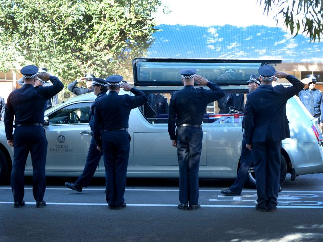 Victoria Police officers form a guard of honour at Ray McNish's funeral. Picture Lana Murphy /Riverine Herald