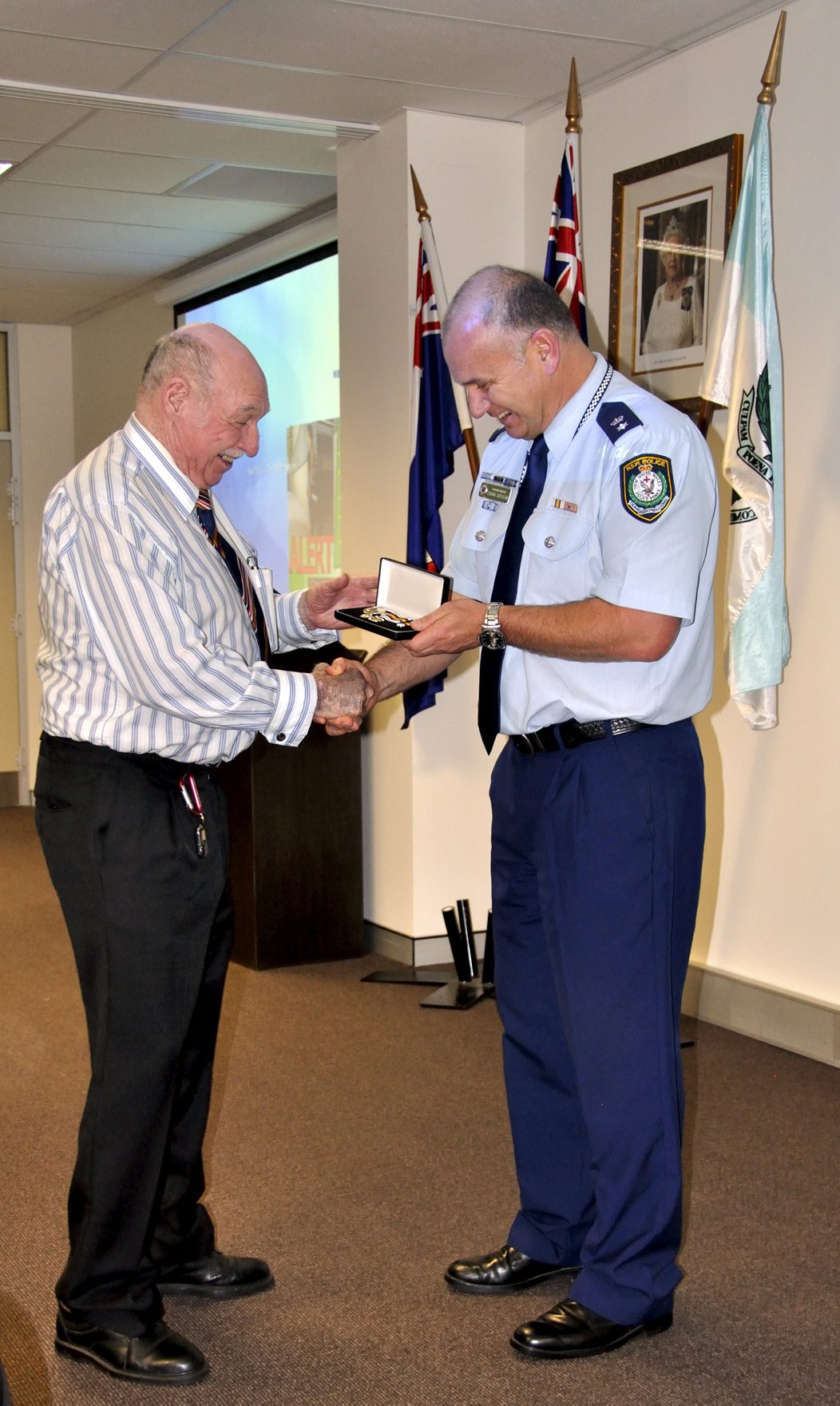 Sid AXAM receiving his National Police Service Medal at Retired Police Day - Lake Illawarra Police Station on 8 September 2016 by acting Local Area Commander, Supt. Zoran Dzevlan.