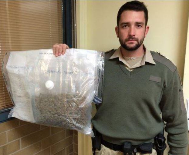 FOUND: Brevet Sergeant Ashley Meek with the cannabis found on the Eyre Highway.