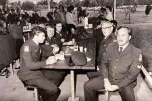 From left closest around the table, Con. Scott Martin, Sgt Barry Stoker, Con. Dave Lonergan, Ch/Insp. Frank Metz, S/C Mark Grigg. 