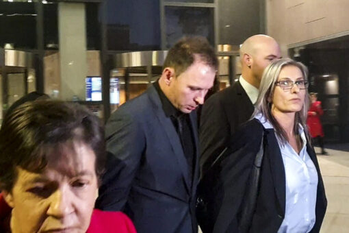 Father-of-two Tommy Balla (centre) leaves Parramatta District Court in Sydney, Friday, June 4, 2021. Balla faced a sentence hearing after pleading guilty to dangerous driving occasioning the death of Aaron Vidal, a police constable on his way from work to his pregnant fiancee at home. (AAP Image/Luke Costin)
