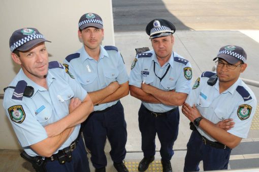 Dubbo police wearing white ribbons in support of an end to domestic and family violence against women yesterday. Pictured are Senior Constable Jason Pollack, Constable Michael Dawn, Inspector Brad Edwards, Constable Tofazzal Ali. 