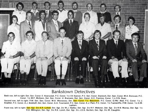 Bankstown Detectives: Back Row ( L - R ) Det SenCon E. HAWRYSIUK, P.C.Cst 1/c I.B. KEENAN, P.C. SenCon STANIOCH, Det SenCon M.A. DONOVAN, P.C. Cst 1/c M. P. McGANN, Det SenCon U. BRAMANN, Det SenCon G.C. PRENTICE, Cst 1/c R.N. RYAN. Second Row ( L- R ) P.W Det SenCon M.A. WESTAWAY, Det SenCon Trevor Lyle BEAUMONT # 14058, P.C. Cst G.Md. ABEL, P.C. Cst 1/c J. KHALIFEH, P.C. Cst A.J. BICKHOFF, Det SenCon A.A. TOWNSEND, P.C. SenCst K.J. PLATT, P.C. Cst 1/c TUNNICLIFFE, P/W Cst 1/c G. M. LAPHAM. Front Row ( L - R ) Det Sgt 3/c A.R. LYTHALL, Det Sgt 3/c W. J. HADLEY, Det Sgt 3/c R.F. WEBSTER, Det Sgt 2/c R.N. MURRAY, Det Sgt 1/c R.D. MILLINGTON, Det Sgt 3/c R.E. LYNCH, Det Sgt 3/c J.D.G. BARTLETT, Det Sgt 3/c M. COUGHLIN.